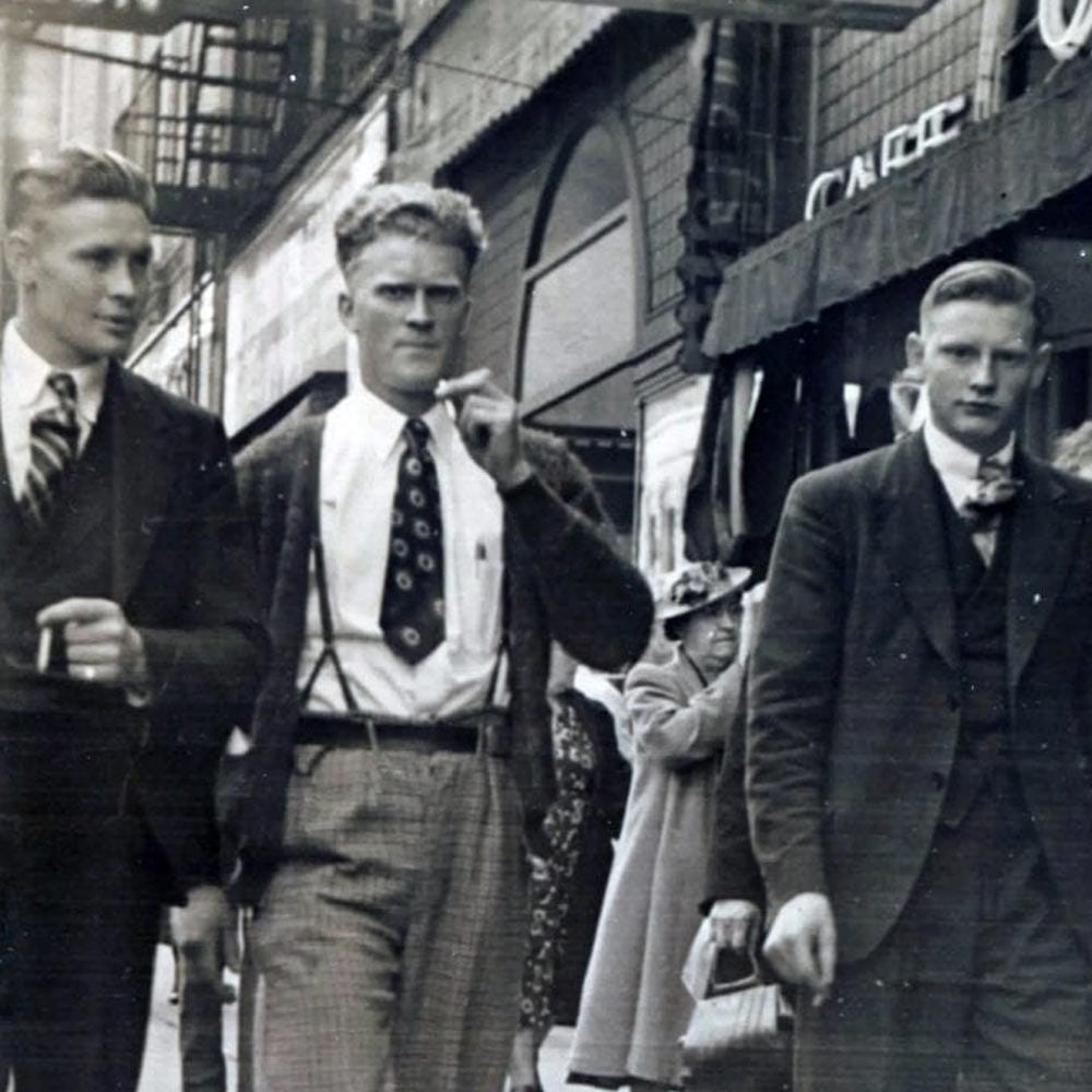 Marcus's grandfather (far right) on a city street, early 1940s